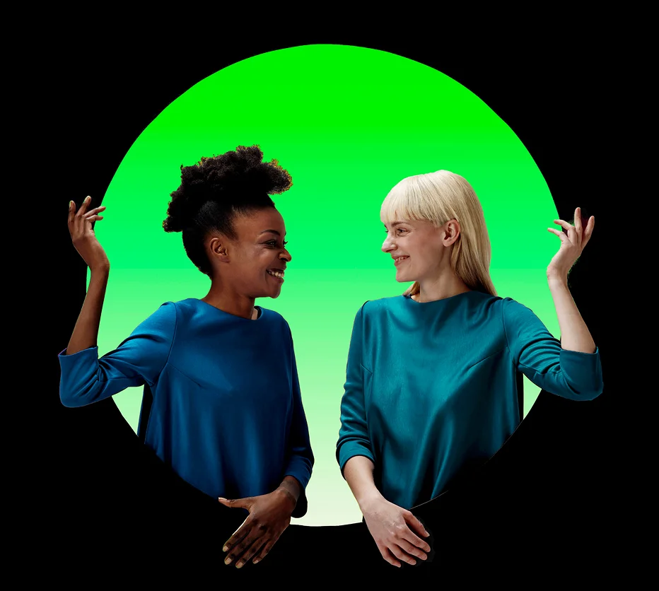 Two Deloitte colleagues talking in front of a green circle